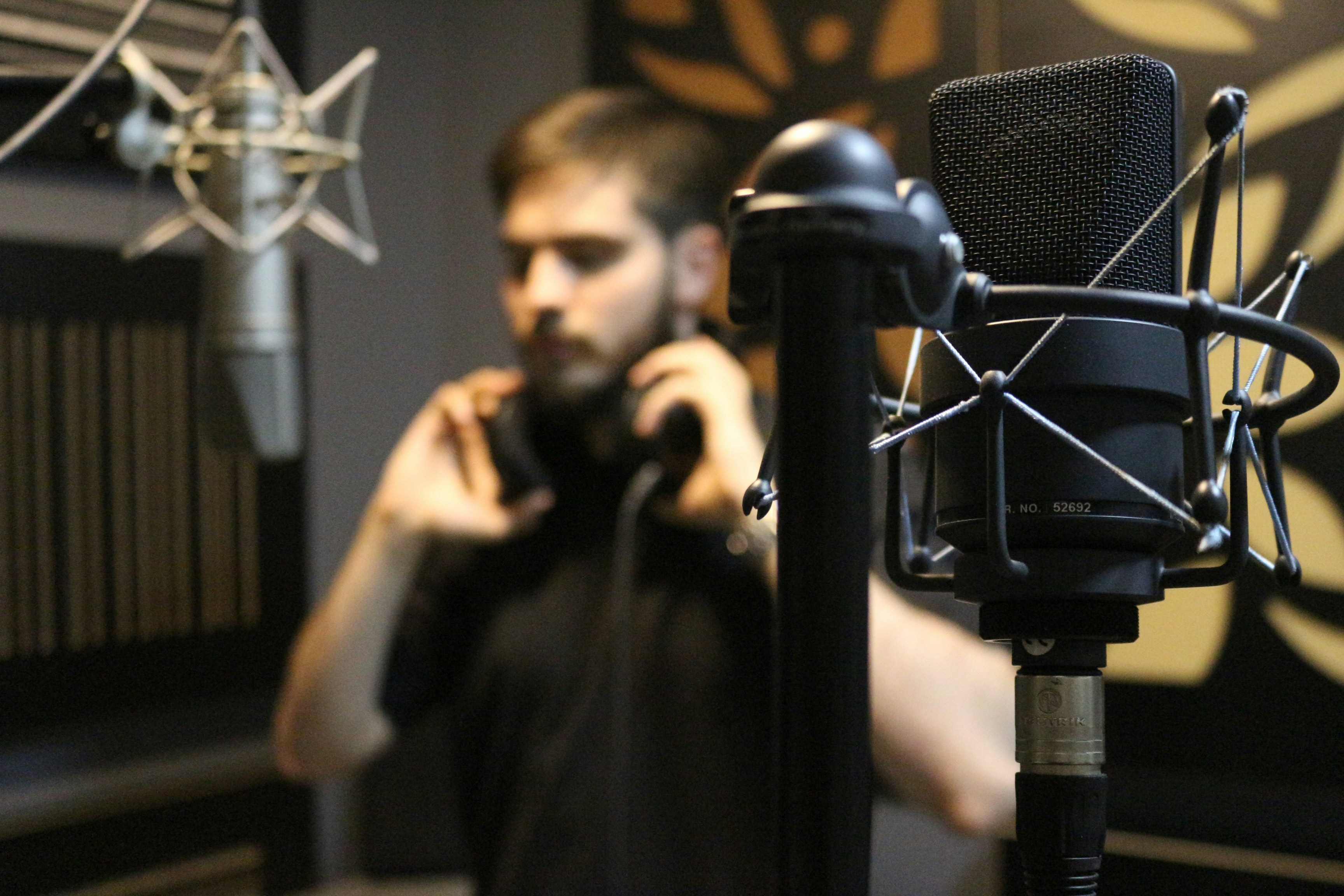  Two microphones and person in recording studio