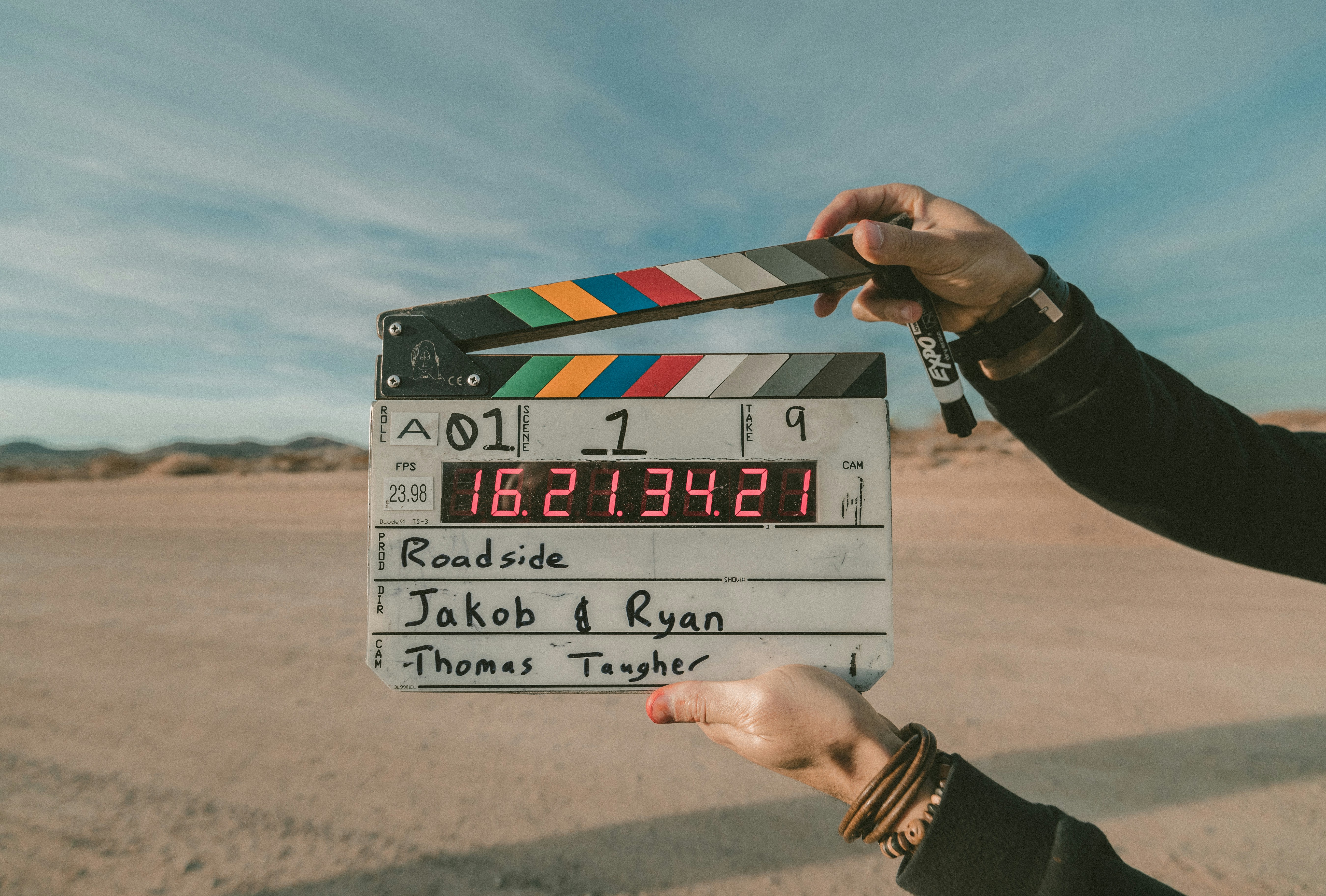 A close-up of a documentary movie clapboard on scene in the desert