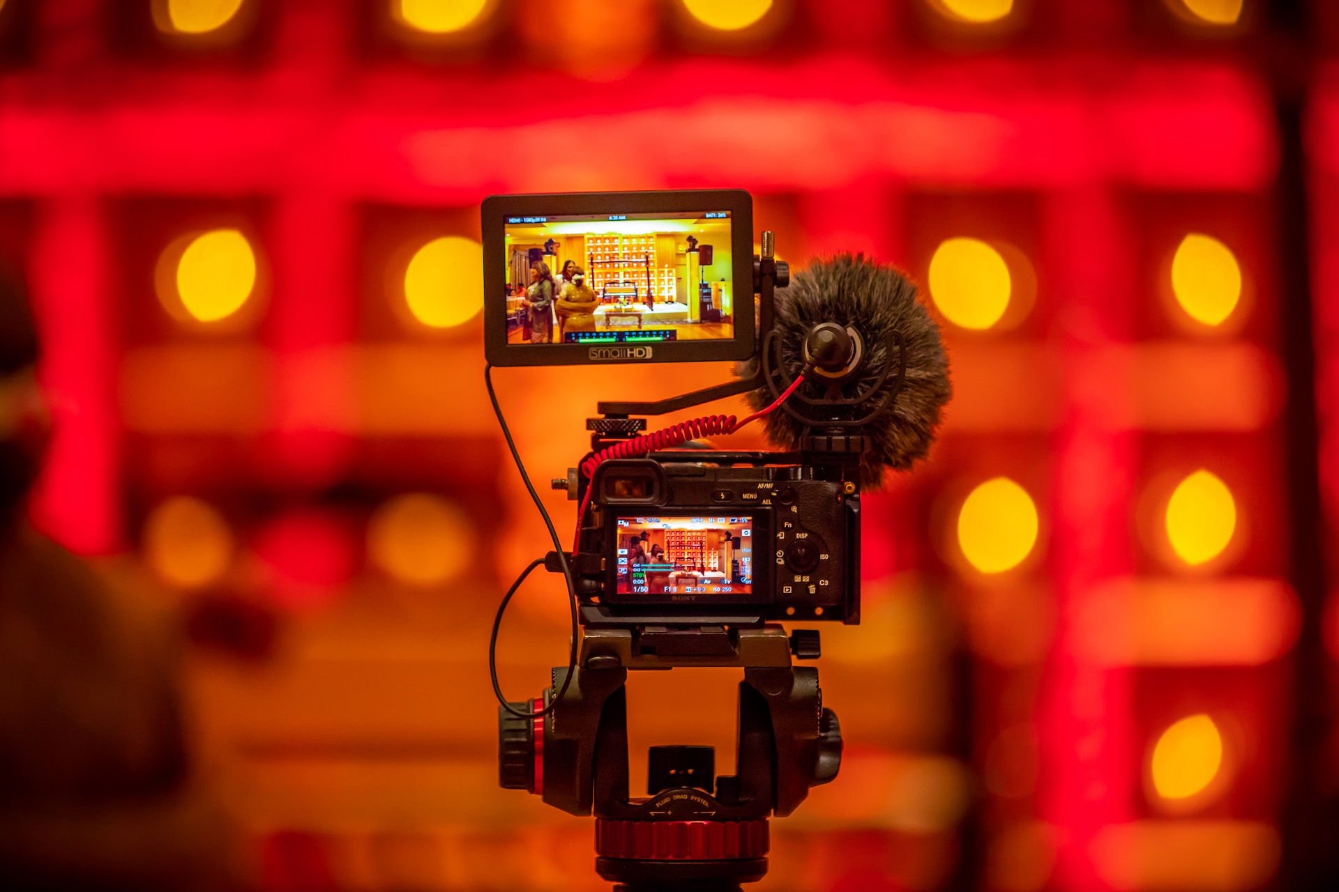 Recording camera over a red background